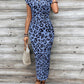 Acquis🥳2026 PROMOÇÃO ESPECIAL 50% DE DESCONTO! 🥳💞Mais de 50 mil unidades vendidas!🌸Vestido justo com nó para mulher – Estampado de leopardo, com nó que realça a barriga. Confortável e elegante para festas ou encontros à noite. Sinta-se deslumbrante. ✨🌹
